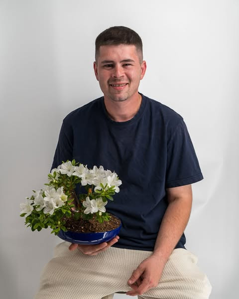 A picture of me and one of my plants.